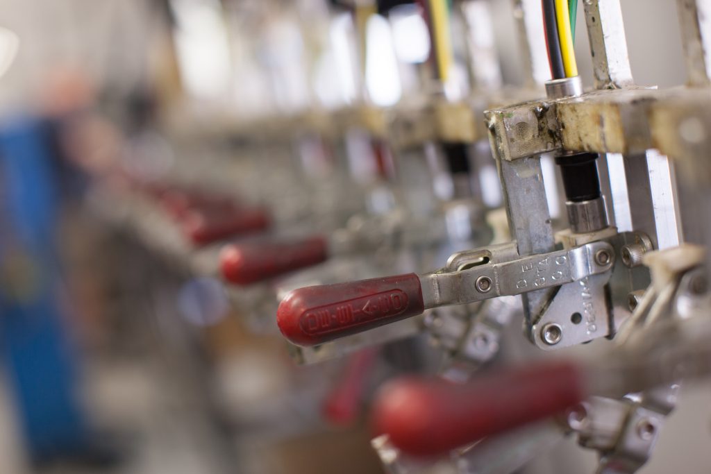 a close of shot of pump levers with red handles