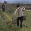 chinese woman carrying water